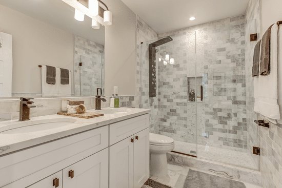 A modern, fully remodeled bathroom with a walk-in shower and double vanity by SRP construction in Houston, TX