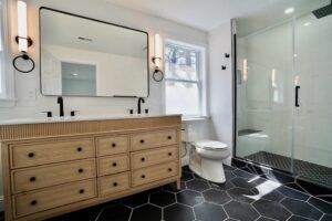 A modern bathroom renovation featuring a double vanity and walk-in shower by Orival Property Services in Boston, MA.
