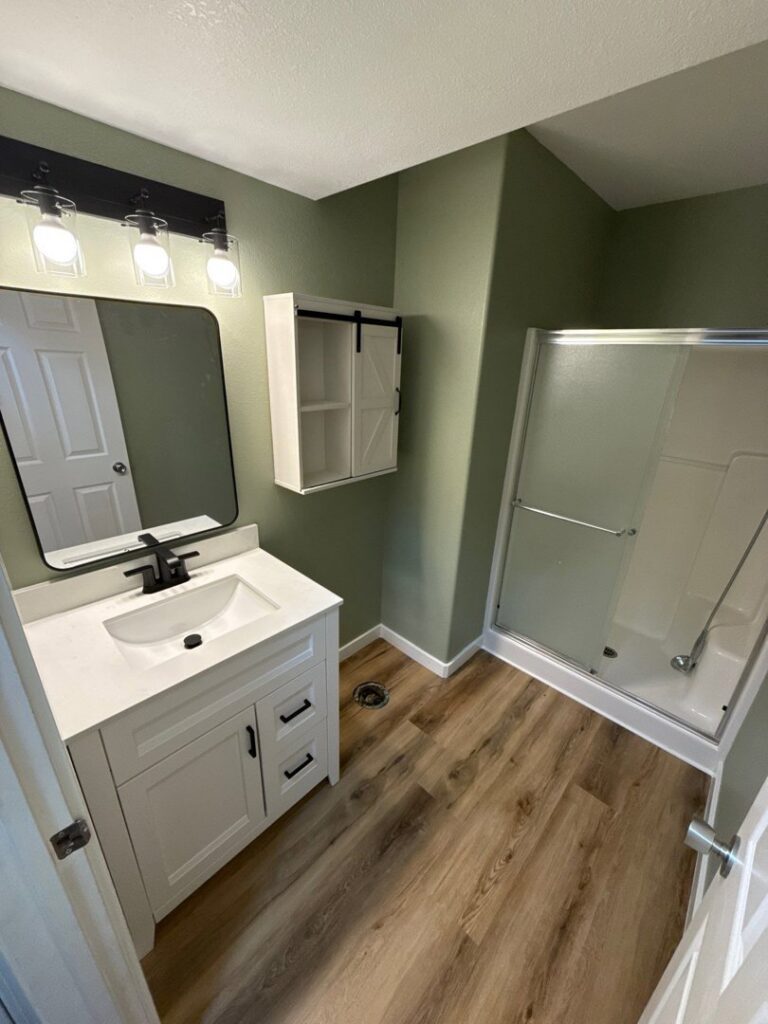 Modern bathroom renovation with new vanity and shower by Panhandle Contracting Co. in Rathdrum, ID