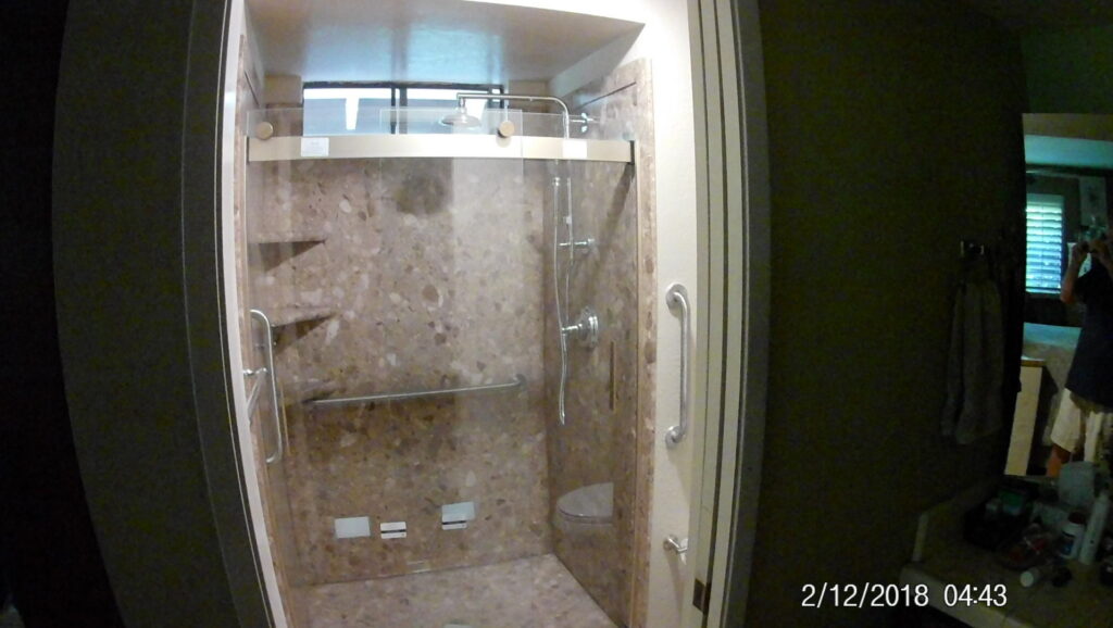 Modern bathroom shower enclosure installation with stone-look tiles by Carpenter Joe's Handyman Service in Sacramento, CA
