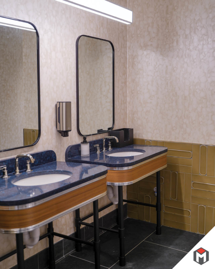 A modern bathroom with dual sinks and stylish mirrors, showcasing installation work by Miranda Construction in Louisville, KY.