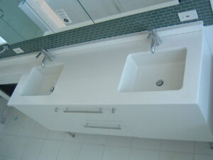 Modern bathroom vanity with double sinks and tiled backsplash installed by Thomas J Stone GC in Yonkers, NY