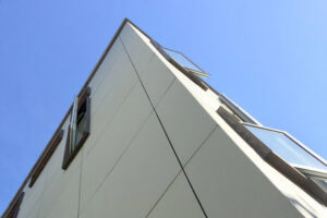 A striking modern building exterior with unique architectural lines and windows, built by Kaleidoscope Design Build in Houston, TX.