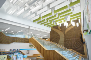 A modern building interior featuring a grand staircase and high ceilings, completed by Bergolla Inc. in Hialeah, FL.