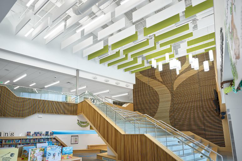 A modern building interior featuring a grand staircase and high ceilings, completed by Bergolla Inc. in Hialeah, FL.