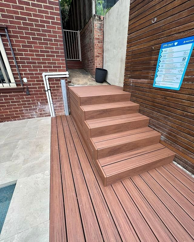 A modern composite deck with integrated stairs, built by All Service Group LLC in San Jose, CA