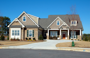 Modern house exterior with visible gutters and a long driveway, serviced by Monroe Gutter Pros in Charlotte, NC.