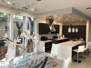 A stunning modern kitchen and dining area renovation completed by Plasters of Italy in Plano, TX