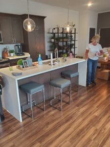 A spacious modern kitchen featuring a large island, a completed project by Affordable Granite of KC in Kansas City, MO.