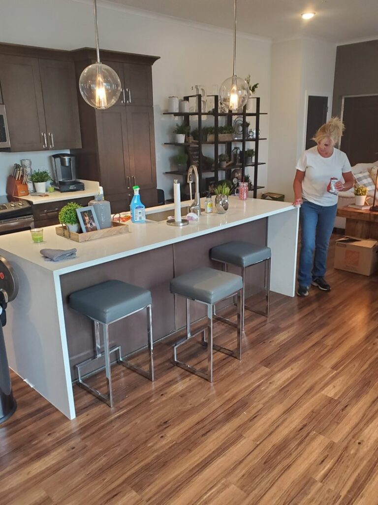 A spacious modern kitchen featuring a large island, a completed project by Affordable Granite of KC in Kansas City, MO.
