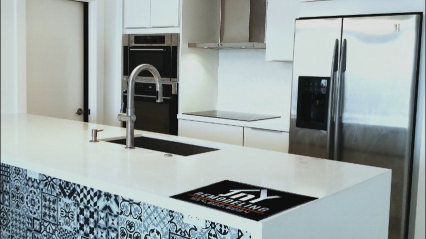 A modern kitchen island with a built-in sink and contemporary design, part of a remodel by JNY Remodeling INC in Fort Lauderdale, FL.