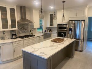 Completed modern kitchen remodel with new cabinets, island, and stainless steel appliances by CWS Handyman LLC in Seekonk, MA