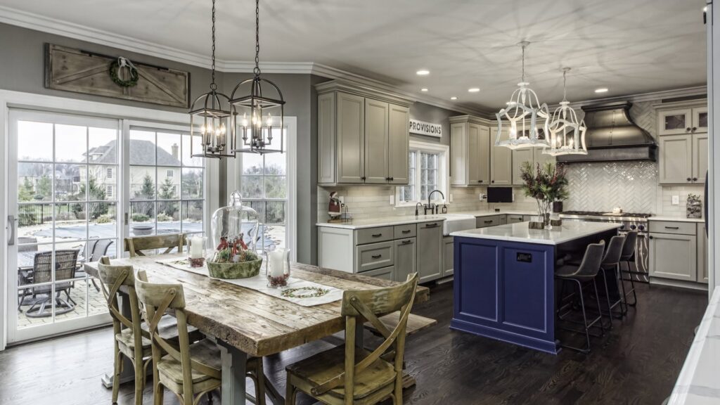 A modern kitchen remodel with a large island and adjacent dining area by Saunders Dynamic Remodeling in Columbus, OH