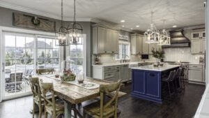 A modern kitchen remodel with a large island and adjacent dining area by Saunders Dynamic Remodeling in Columbus, OH