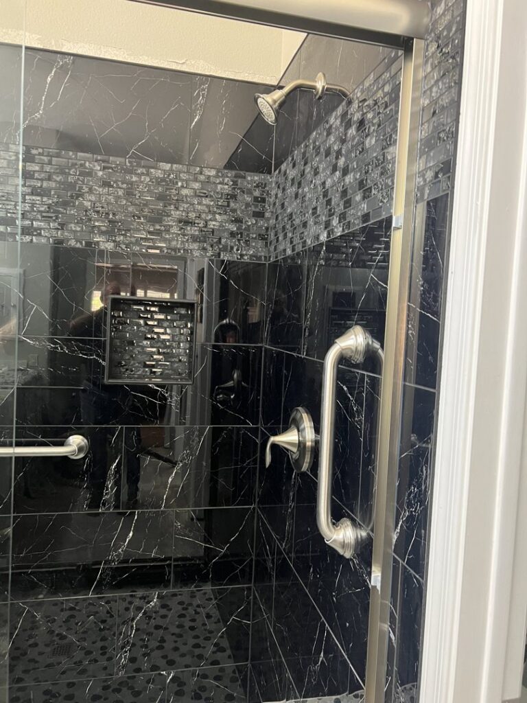 A modern kitchen remodel featuring a large island and new cabinetry by Southwest Restoration & Design, Inc. in Peoria, AZ.