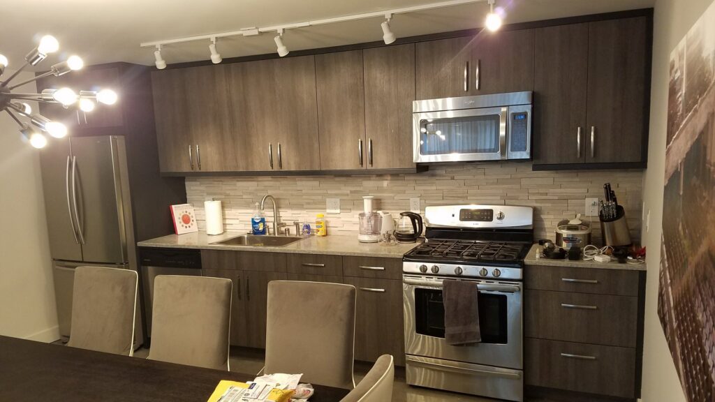 A beautifully renovated modern kitchen with new cabinets and appliances by Barry's Handyman Service in San Diego, CA.