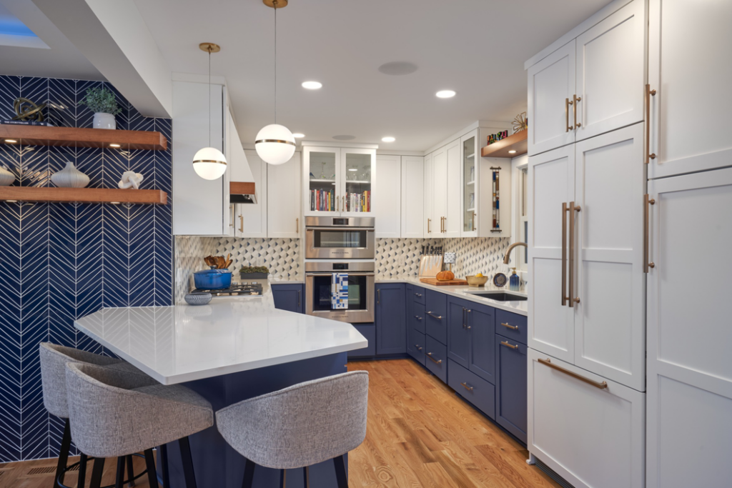 A modern kitchen renovation featuring custom cabinets, island, and backsplash by EdgeWork Design Build in Minneapolis, MN.