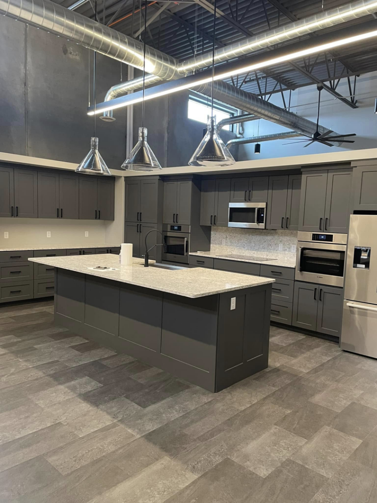 A modern kitchen renovation featuring new cabinets, island, and appliances by DeJean Home Renovation in Yankton, SD.