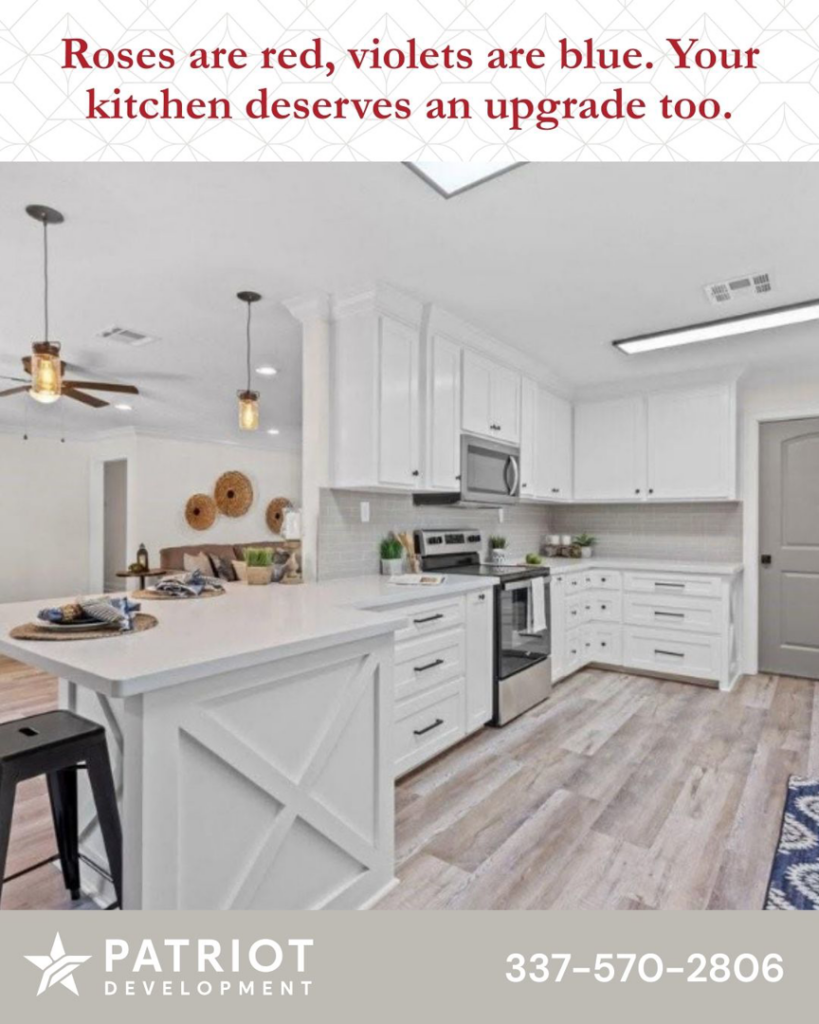 A modern kitchen renovation with white cabinets and an island completed by Patriot Development in Denton, TX.