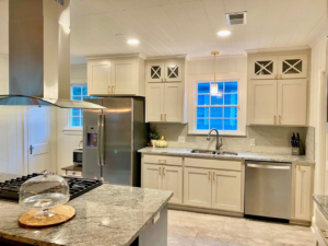A beautiful modern kitchen renovation with new cabinets and stainless steel appliances by Shreveport Contractors in Shreveport, LA.