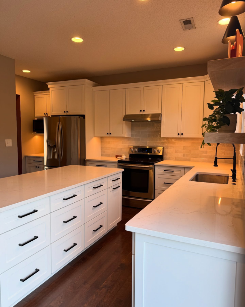A beautifully renovated modern kitchen with white cabinets and new countertops by Special Reserve Contracting in Charlotte, NC.