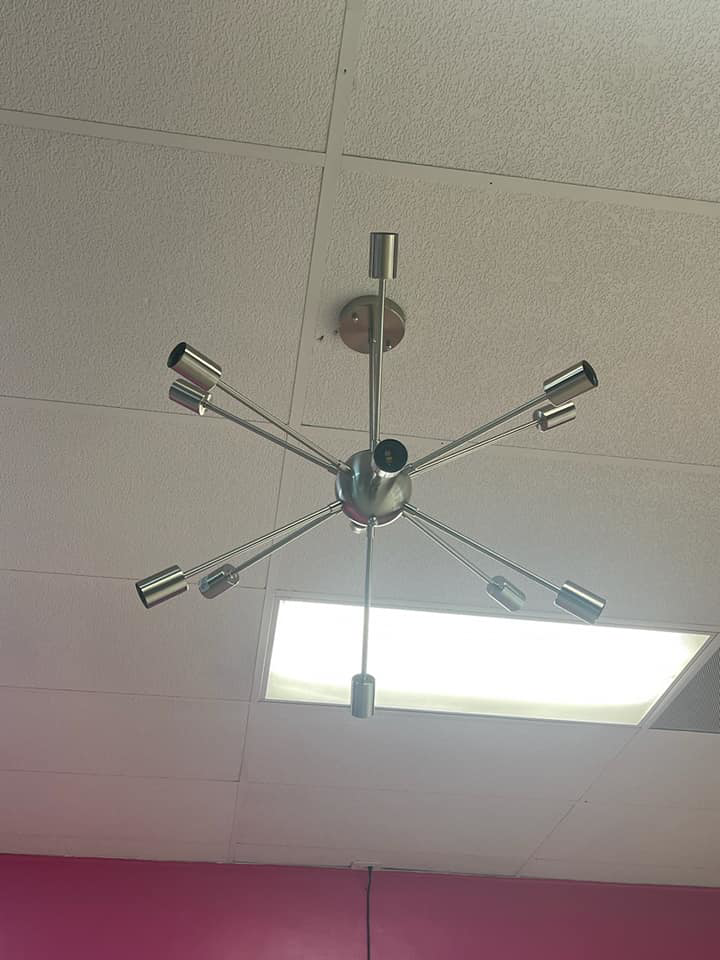 A modern light fixture expertly installed on a ceiling by Tvbypass in Jackson, TN.