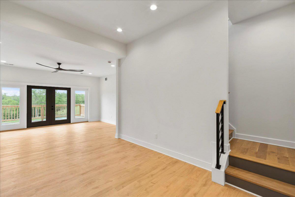 Modern living room featuring light hardwood floors installed or refinished by WoodHaven Floor Refinishing in Georgetown, KY.