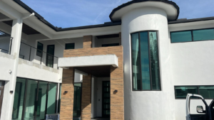 A modern luxury home under construction, demonstrating general contractor expertise by American Glass & Window Inc in Hialeah, FL.