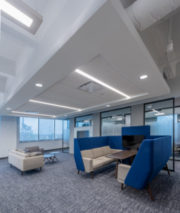 A modern office lounge and waiting area with comfortable seating, a commercial interior project by Drash Contracting Company LLC in San Antonio, TX.