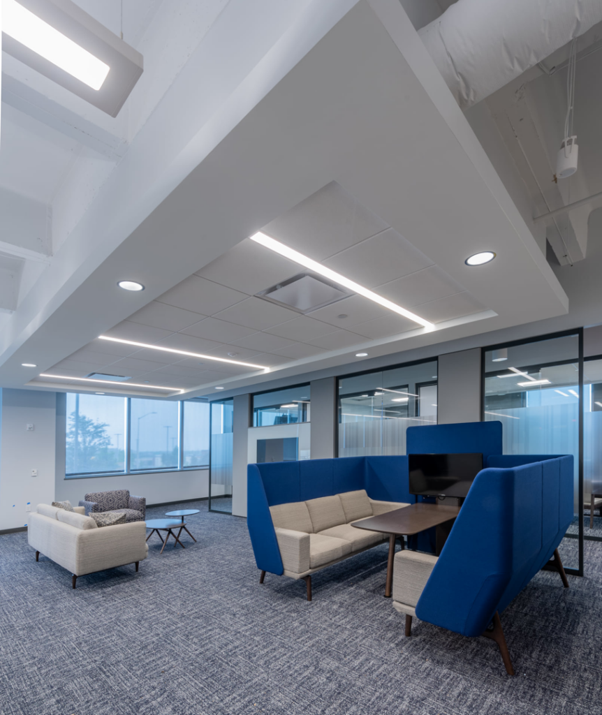 A modern office lounge and waiting area with comfortable seating, a commercial interior project by Drash Contracting Company LLC in San Antonio, TX.