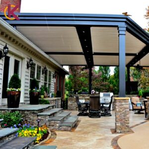 Modern outdoor patio with a large black pergola and stone steps by KC's Improvement & Construction Co., Inc. in Greensboro, NC