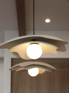 Close-up of modern decorative pendant light fixtures professionally installed by Ella Lee Homes in Scottsdale, AZ.