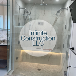 A newly installed modern shower with multiple showerheads and marble-look tiles by Infinite Construction LLC in Bristol, CT.