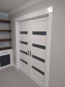 Installation of modern sliding doors and custom built-in shelves by Eagle Rock Handyman Services in Caldwell, ID.
