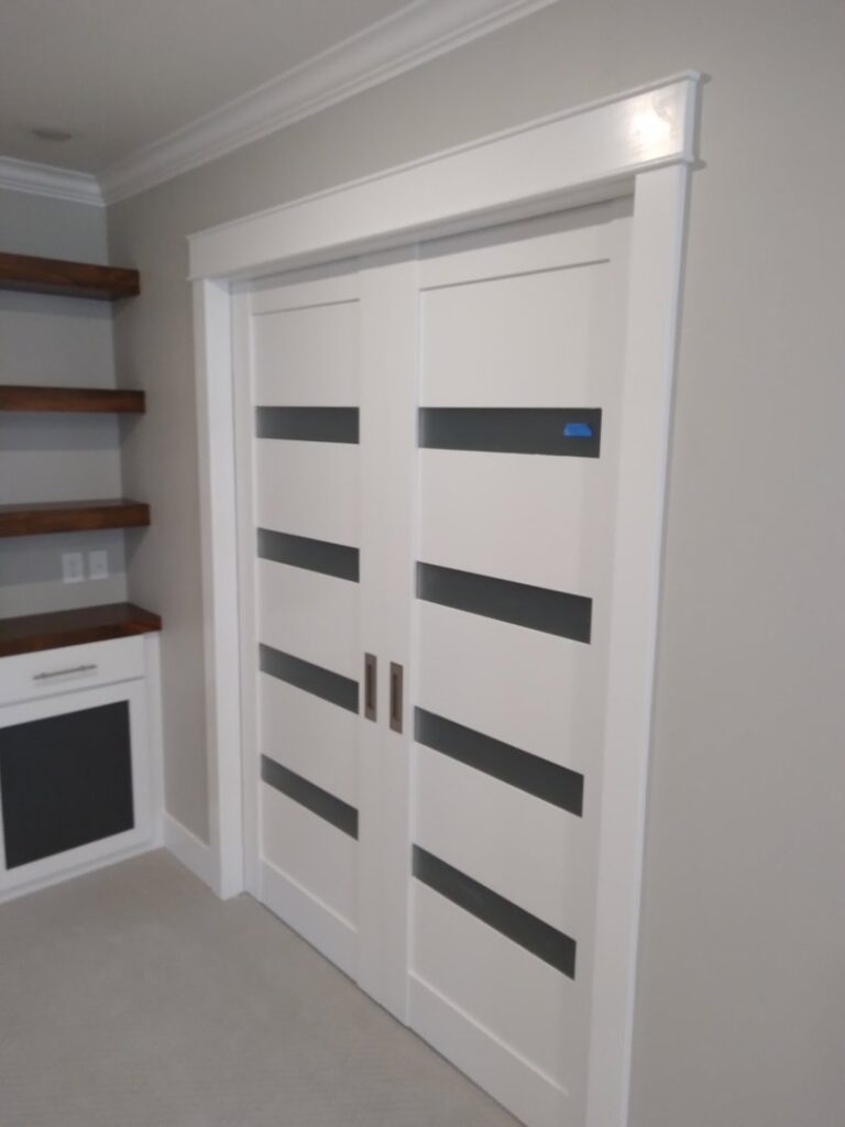 Installation of modern sliding doors and custom built-in shelves by Eagle Rock Handyman Services in Caldwell, ID.