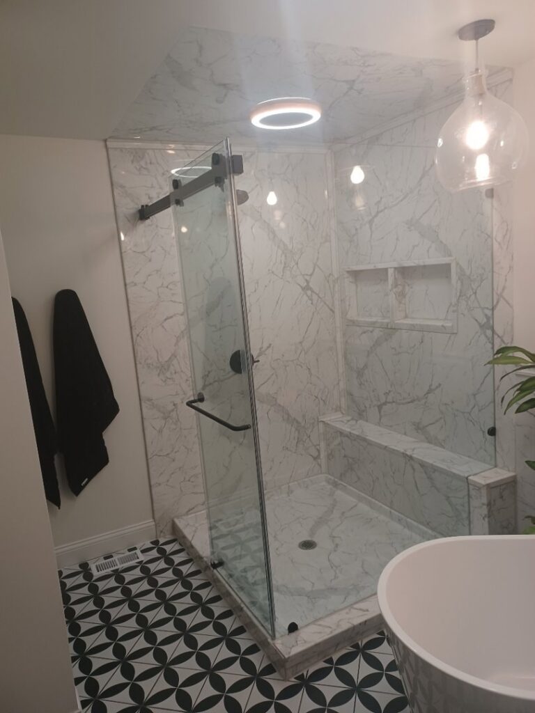 A newly renovated modern bathroom featuring a walk-in shower with glass enclosure by Bath Planet of STL & More in Saint Charles, MO.