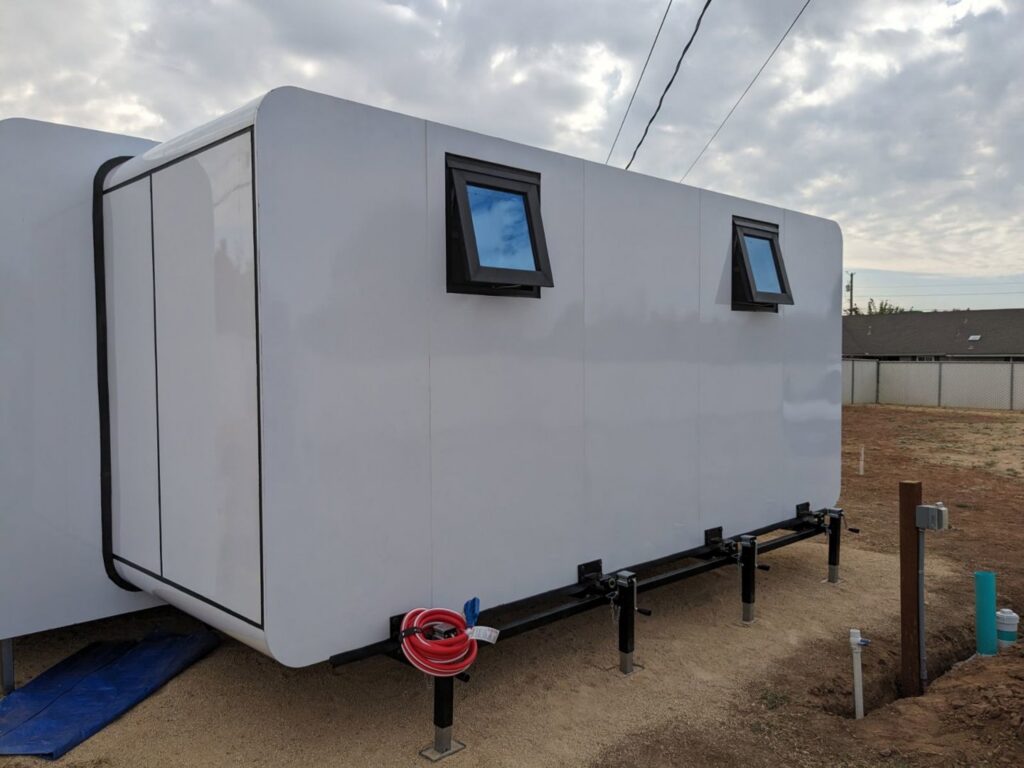 Installation of a white modular building or ADU with small windows by My Quality Handyman in Fresno, CA.