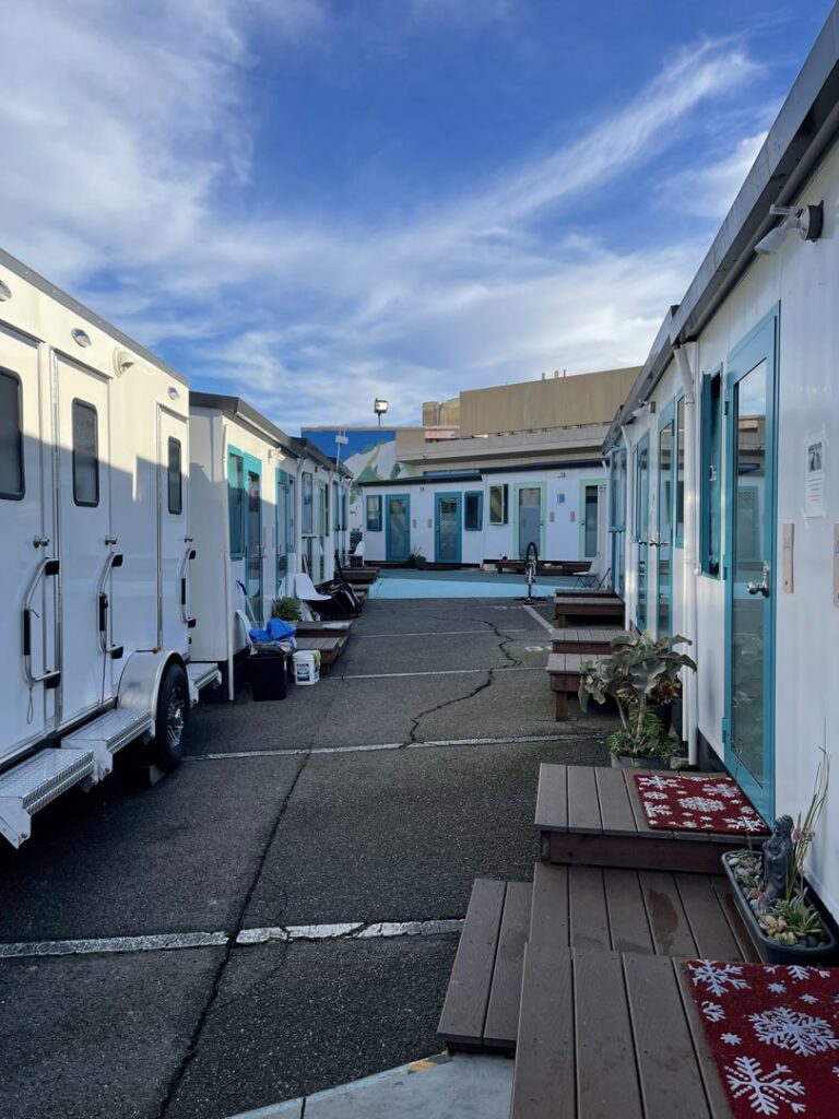 A row of modular facilities and portable restroom trailers installed on a site by Comforts of Home Services Inc in Aurora, IL