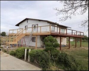 Multi-level wooden deck under construction or renovation, showcasing craftsmanship by Fisher Construction, LLC in Selah, WA.