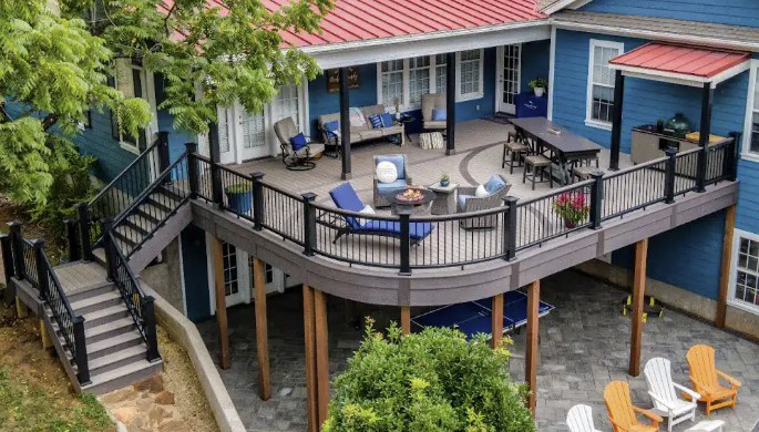 A spacious multi-level deck with stairs and outdoor seating installed by Sean Kingery Award Winning Homes in Richmond, KY
