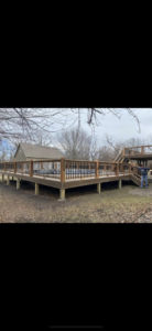 A newly constructed multi-level deck with an integrated pool by Chad Fry the Deck Guy LLC in Blue Springs, MO.