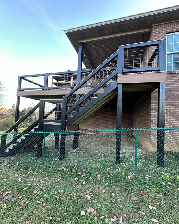 A modern multi-level deck featuring black railings with wire mesh, expertly constructed by Matt Hingle Construction in Bowling Green, KY.