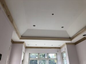 Finished multi-level tray ceiling with elegant crown molding by D&G Drywall in Fort Lauderdale, FL