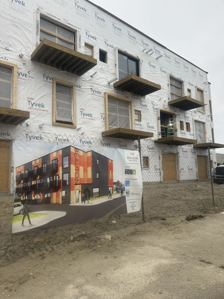 A multi-unit building under construction with balconies being framed by New Life Custom Carpentry in Livonia, MI.
