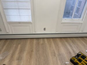 Multiple baseboard heating units installed along a wall in a room by Clear Flow Plumbing, Heating, and Hvac Contractors LLC in Jersey City, NJ