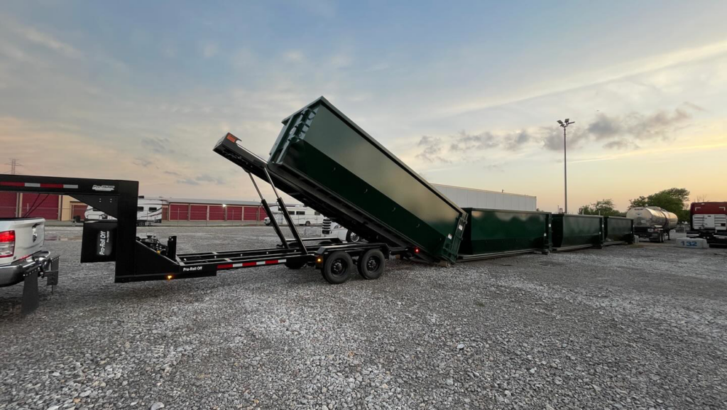 Multiple MoJo Hauling LLC dumpster trailers unloading junk at a large disposal facility in Bartlesville, OK.