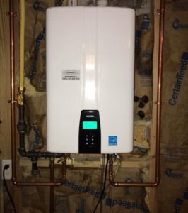 A Navien tankless water heater installed with copper piping by Read Plumbing LLC in Ankeny, IA.
