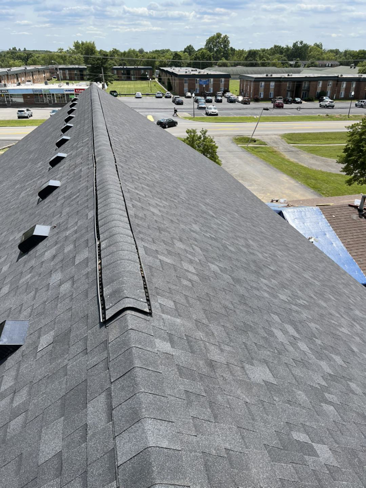 A newly installed asphalt shingle roof with vents by Brother George Remodeling & Construction in Louisville, KY.