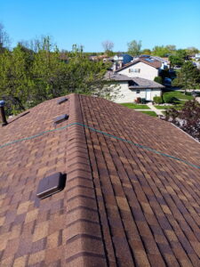 An aerial view of a newly installed brown asphalt shingle roof on a residential home by Stingray Construction Group, Inc. in Chicago, IL