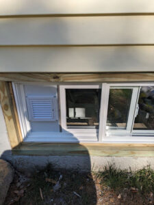 New basement window vent and trim installation by MB&E Home Improvement in Augusta, ME.